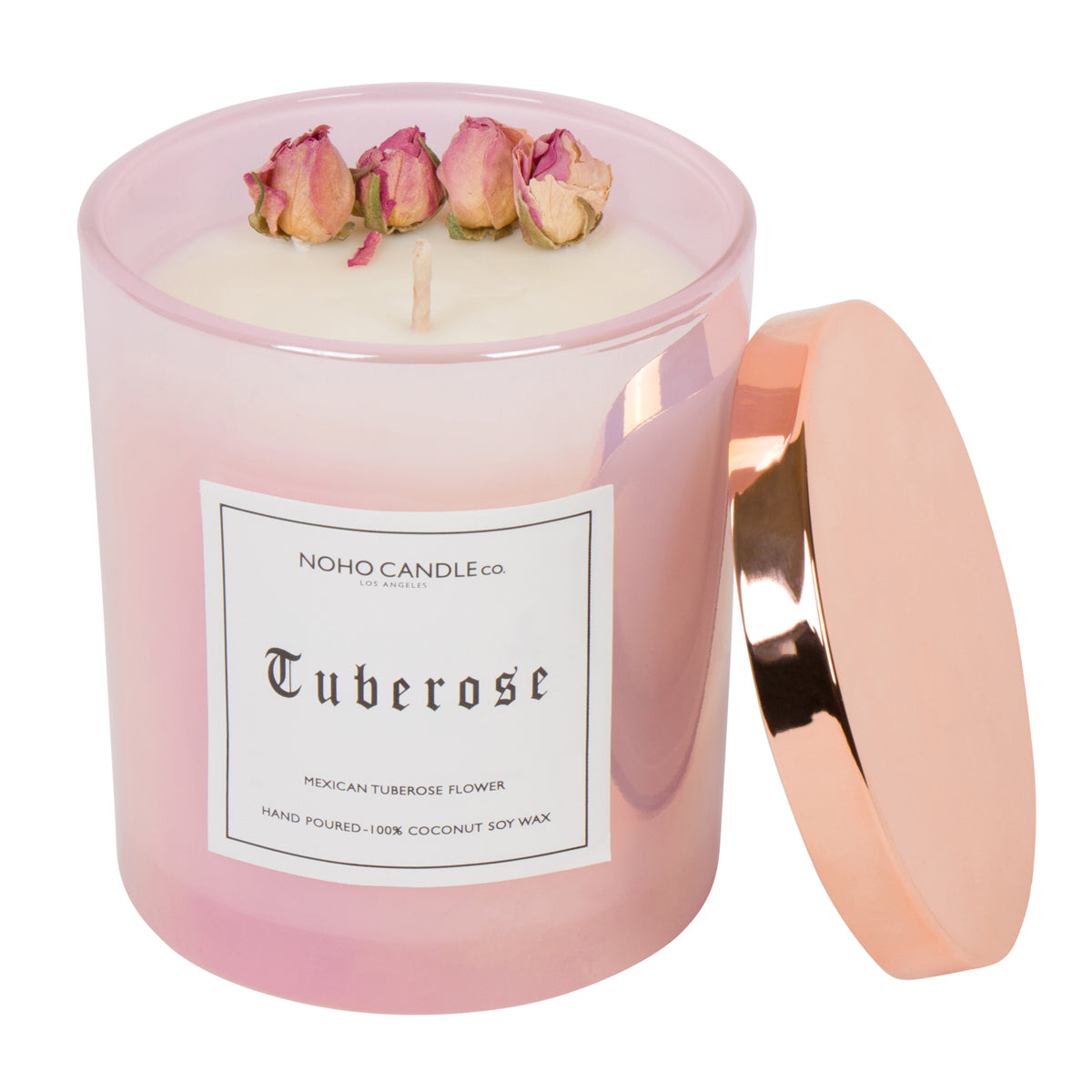 A 14oz Tuberose cotton wick candle from the floral collection.  The wax is white and there are four natural, dried roses arranged around the outer edge.  The candle is poured into an iridescent pink glass with a copper lid that pops on and off.