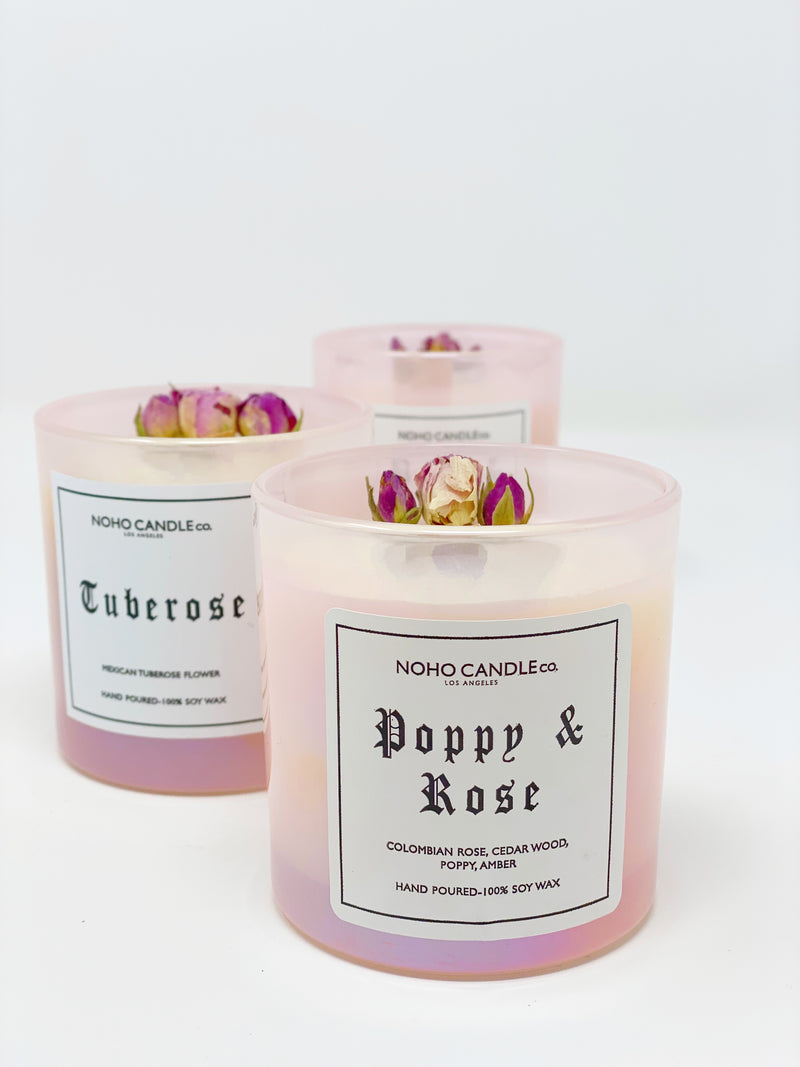 An assortment of three 10oz floral collection candles, including Tuberose and Poppy and Rose.