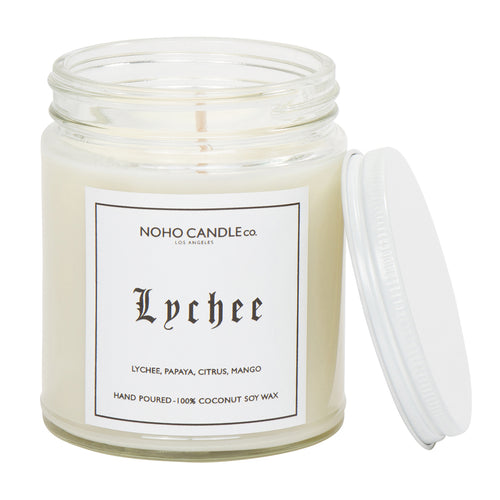 A clear 9oz jar with 8oz of white candle inside it.  The lid is white and screws on.