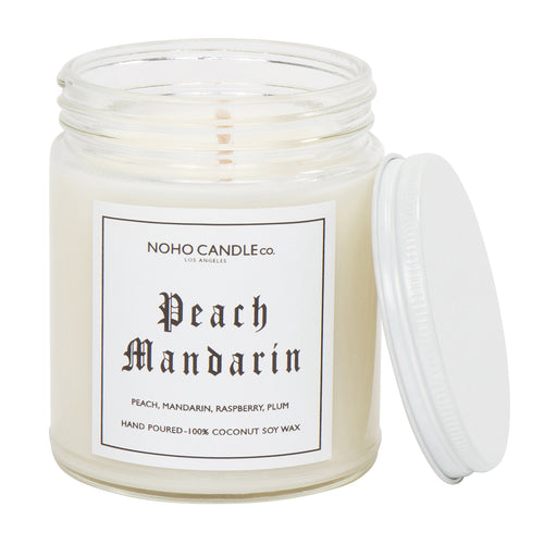 A clear 9oz jar with 8oz of white candle inside it.  The lid is white and screws on.