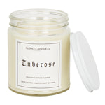 A clear 9oz jar with 8oz of white candle inside it.  The lid is white and screws on.