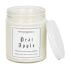 A clear 9oz jar with 8oz of white candle inside it.  The lid is white and screws on.