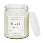 An 8oz short Black Sea candle.  The jar is clear and the candle is white. The lid to the jar is white and screws on.