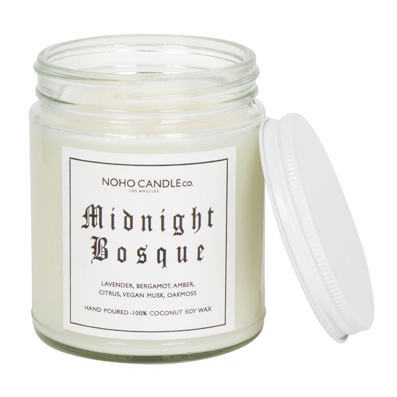 A clear 9oz jar with 8oz of white candle inside it.  The lid is white and screws on.