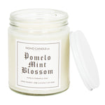 A clear 9oz jar with 8oz of white candle inside it.  The lid is white and screws on.