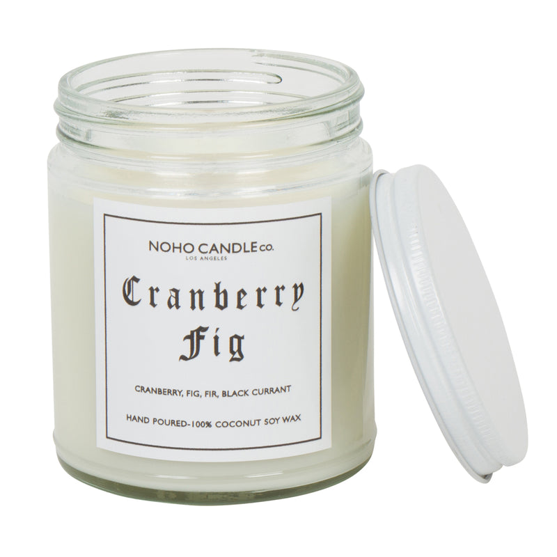 An 8oz short Cranberry Fig candle.  The wax is white, the jar is clear, and the lid is white and screws on.