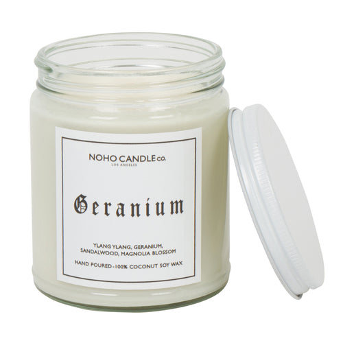 An 8oz short Geranium candle with white wax and a white screw-on lid.