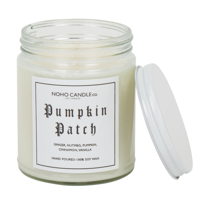 An 8oz short Pumpkin Patch candle.  The wax is white, the jar is clear, and the lid is white and screws on.