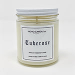 8 ounces of Tuberose candle in a 9-ounce jar.  It has a white screw-on lid.