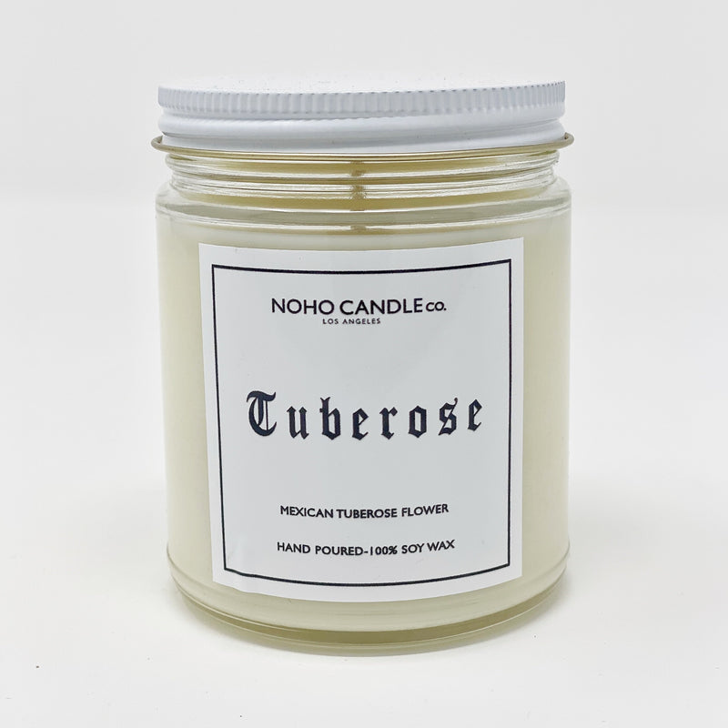 8 ounces of Tuberose candle in a 9-ounce jar.  It has a white screw-on lid.